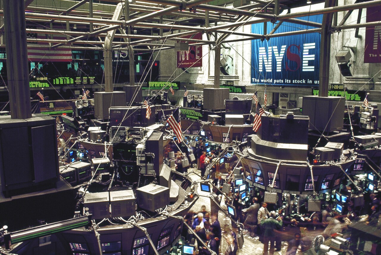 Trading floor of the New York Stock Exchange with specialists working at electronic terminals